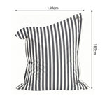 Ambiance jardin avec pouf gris foncé