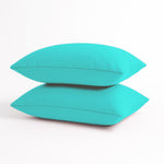 Deux coussins d'appoint décoratifs bleus Caraïbes de 60x35 cm, déhoussables, pour décoration de jardin.