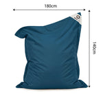 Ambiance jardin avec pouf bleu pétrole